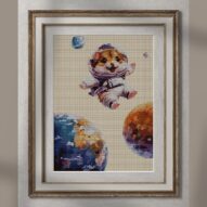 saturn-hamster alternative framed cross stitch mockup, realistic finished embroidery presentation