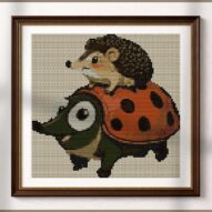 riding-hedgehog-ladybug alternative framed cross stitch mockup, realistic finished embroidery presentation