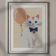 cat-with-balloon alternative framed cross stitch mockup, realistic finished embroidery presentation