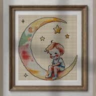 key-hanging-from-moon alternative framed cross stitch mockup, realistic finished embroidery presentation
