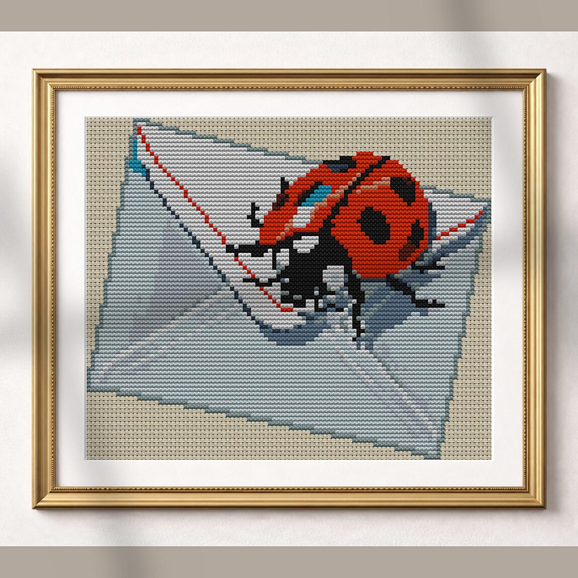 ladybug-reading-letter alternative framed cross stitch mockup, realistic finished embroidery presentation