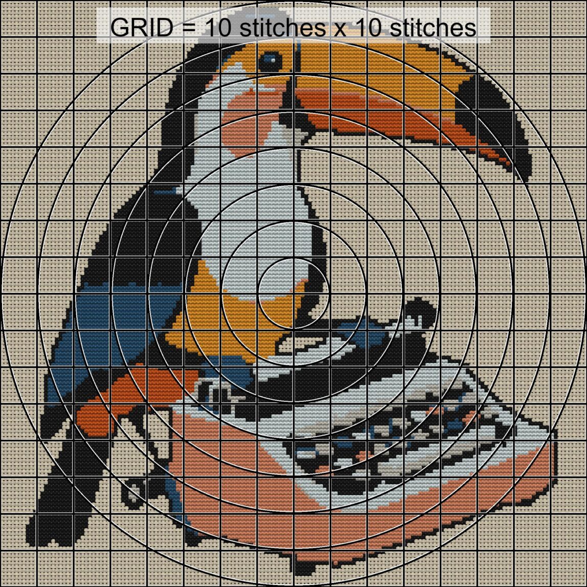 toucan-typing-on-typewrit close-up cross stitch detail showing color changes, confetti areas and stitch texture