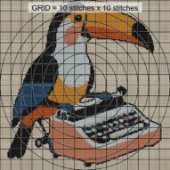 toucan-typing-on-typewrit close-up cross stitch detail showing color changes, confetti areas and stitch texture
