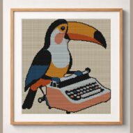 toucan-typing-on-typewrit framed cross stitch mockup, realistic finished embroidery design, PDF pattern digital download