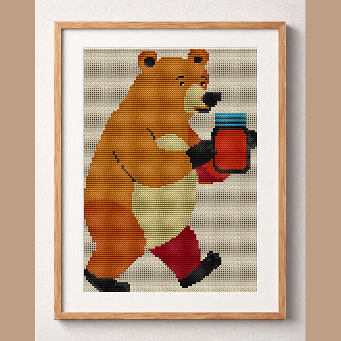 bear-carrying-honey-jar-a framed cross stitch mockup, realistic finished embroidery design, PDF pattern digital download