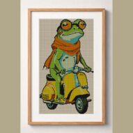 frog-on-vespa framed cross stitch mockup, realistic finished embroidery design, PDF pattern digital download