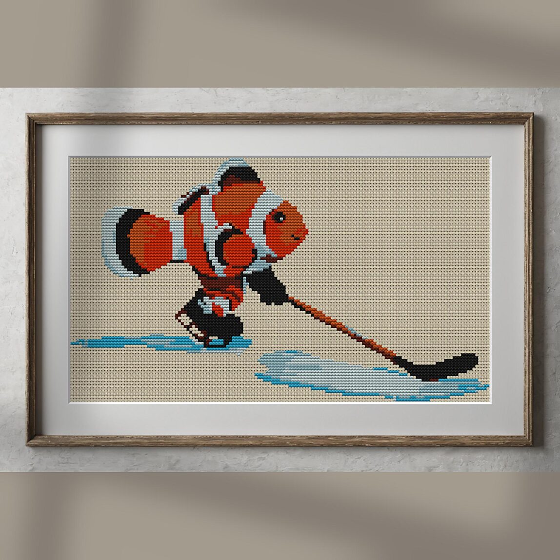 clownfish-hockey alternative framed cross stitch mockup, realistic finished embroidery presentation