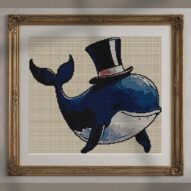 whale-with-top-hat alternative framed cross stitch mockup, realistic finished embroidery presentation
