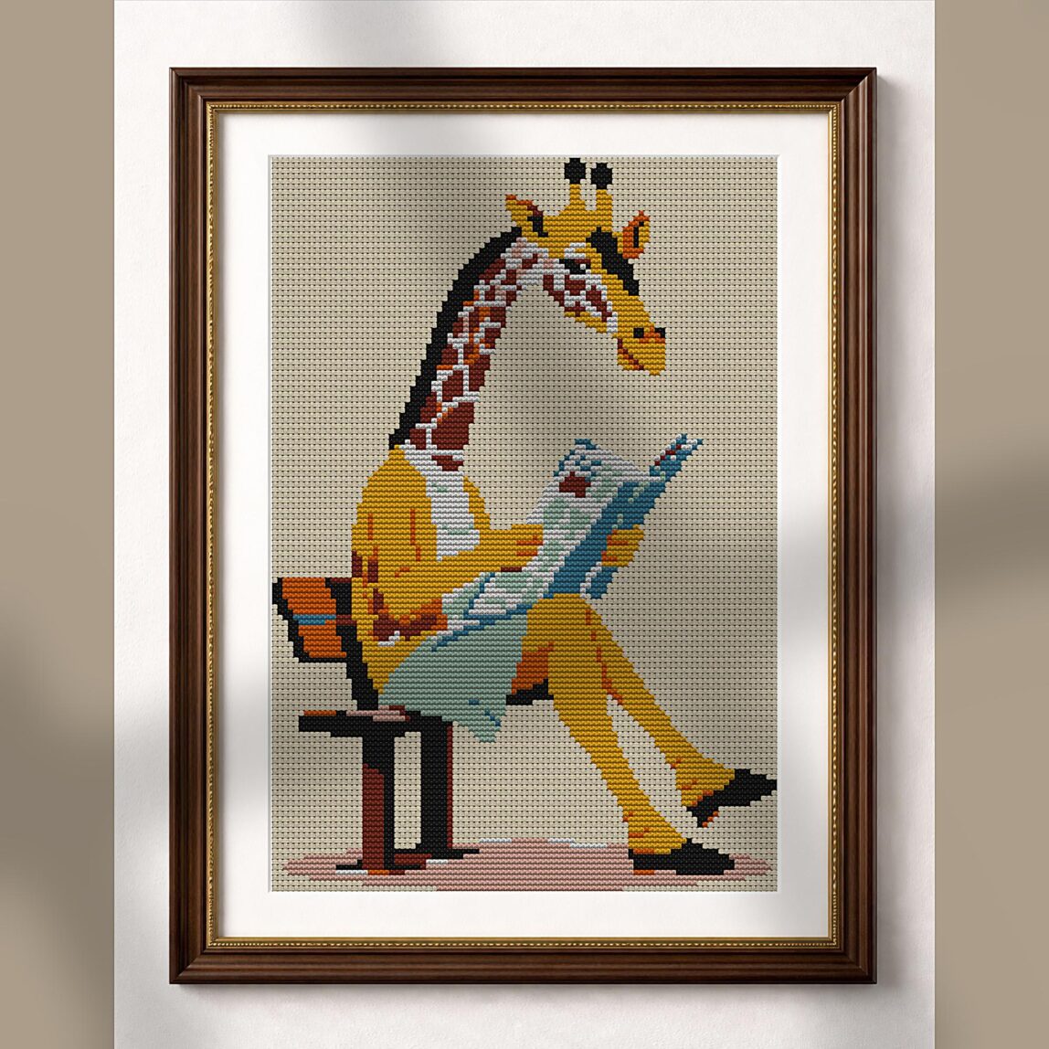 giraffe-reading-newspaper alternative framed cross stitch mockup, realistic finished embroidery presentation